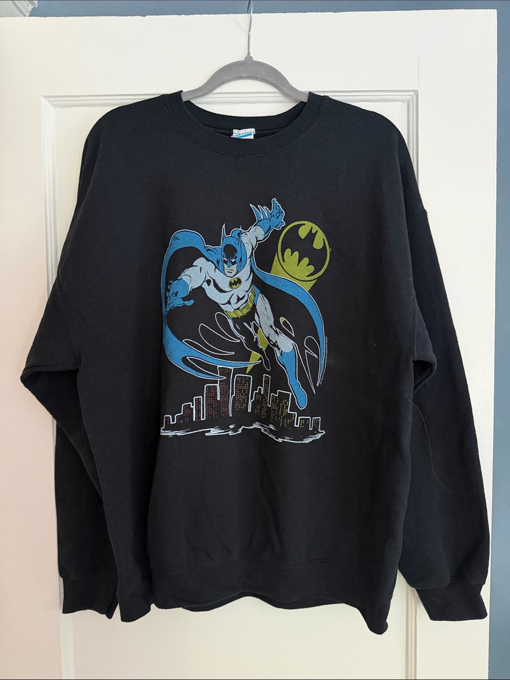 Junk Food Clothing Black Batman Crewneck with Blue and Yellow Graphic